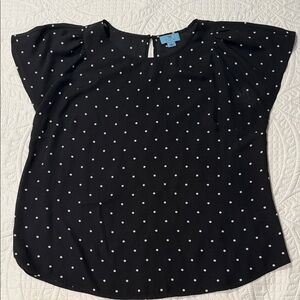 CeCe black top with white polka dots and flutter cap sleeves